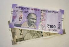 Indian rupee notes of hundred and five hundred denominations.